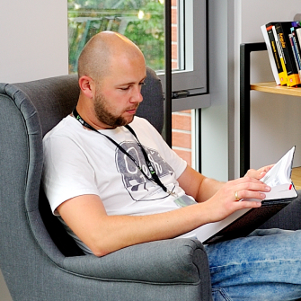 Graphic Designer man is reading a book