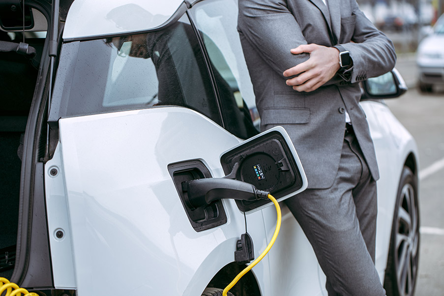 white electric vehicle is charging